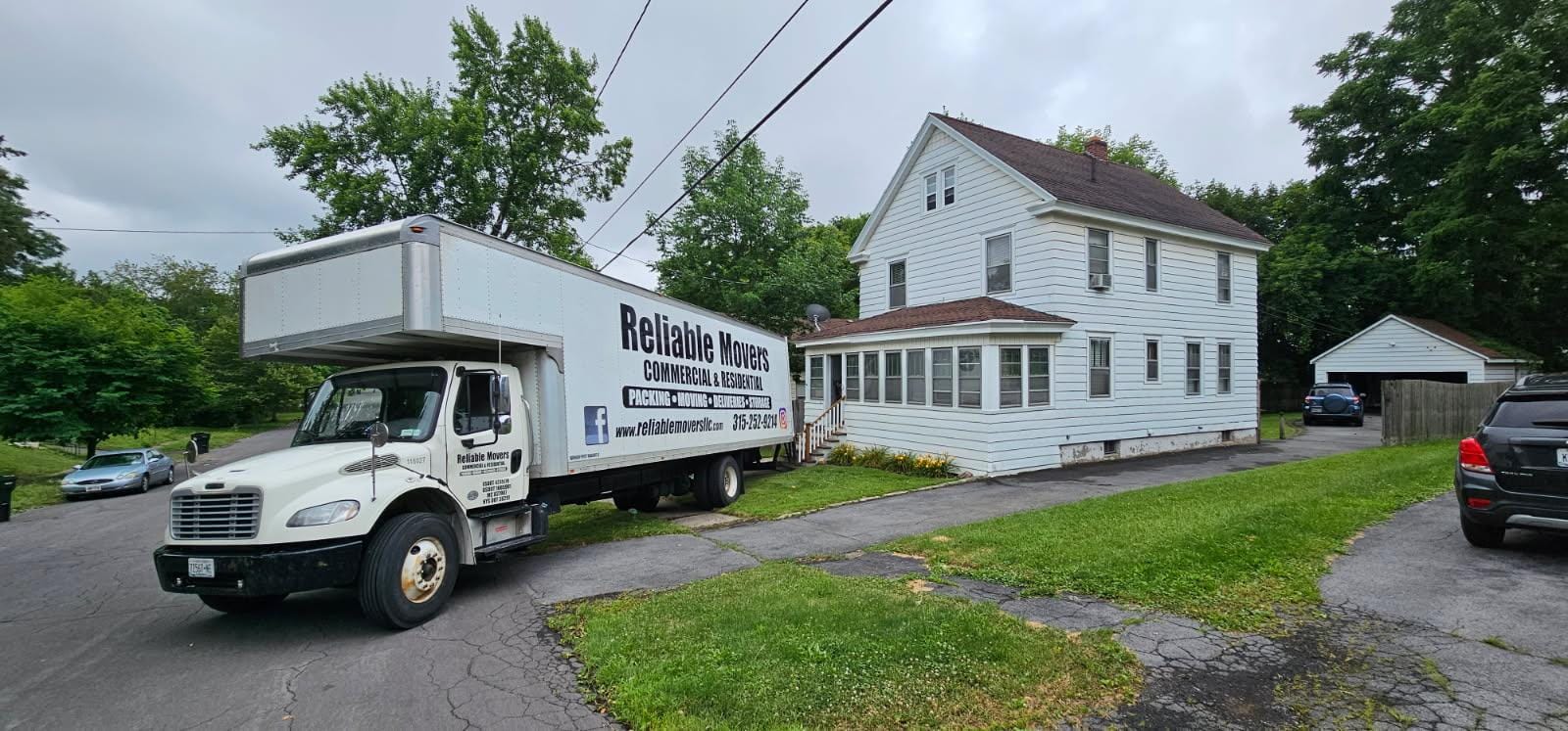 Reliable Movers loading interstate moving truck