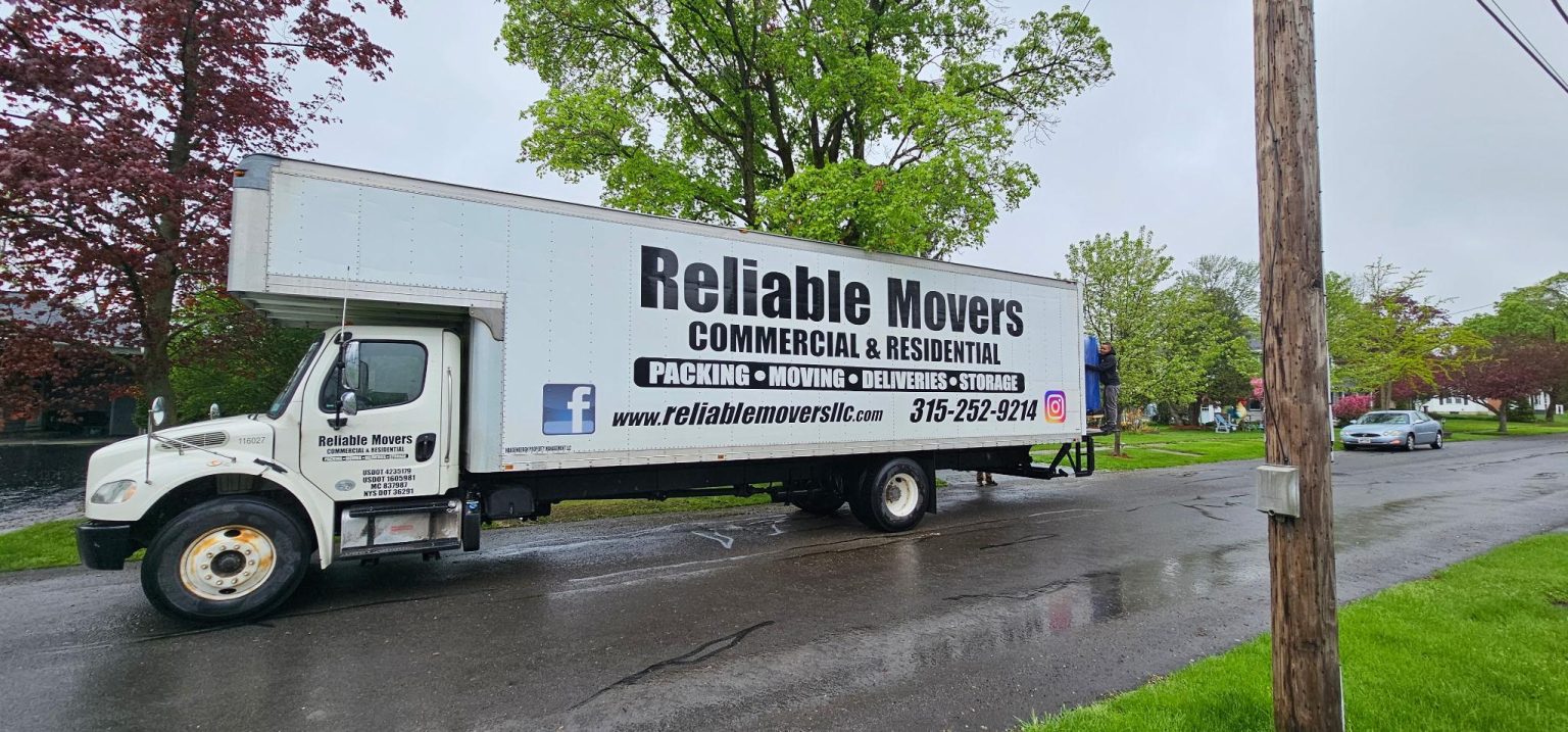 Reliable Movers moving a baby grand piano in Central New York