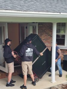 Reliable Movers crew and owner Mike relocating a 900 lb Liberty Gun Safe from New York to Michigan.
