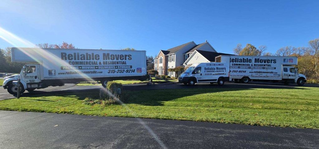 Reliable Movers crew performing a two-truck local move from Manlius to storage on October 21, 2025