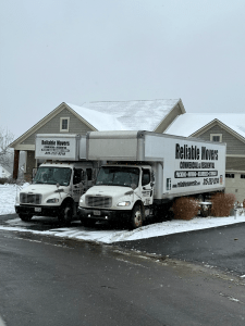 Two Reliable Movers trucks parked in Jamesville, NY for a large local move