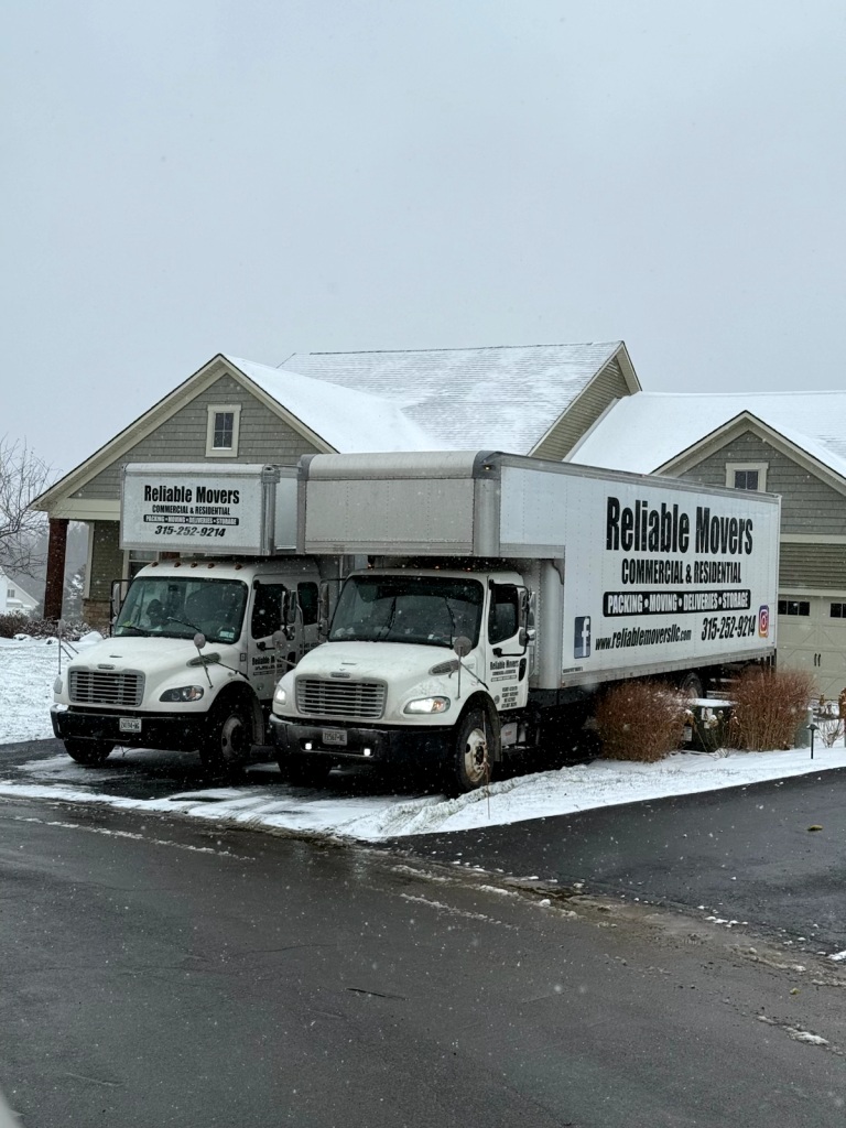 Two Reliable Movers trucks parked in Jamesville, NY for a large local move