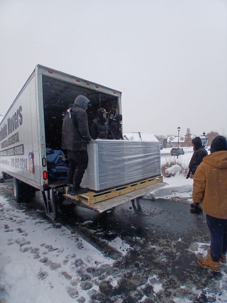 Reliable Movers moving a 1200 salt water fish tank.