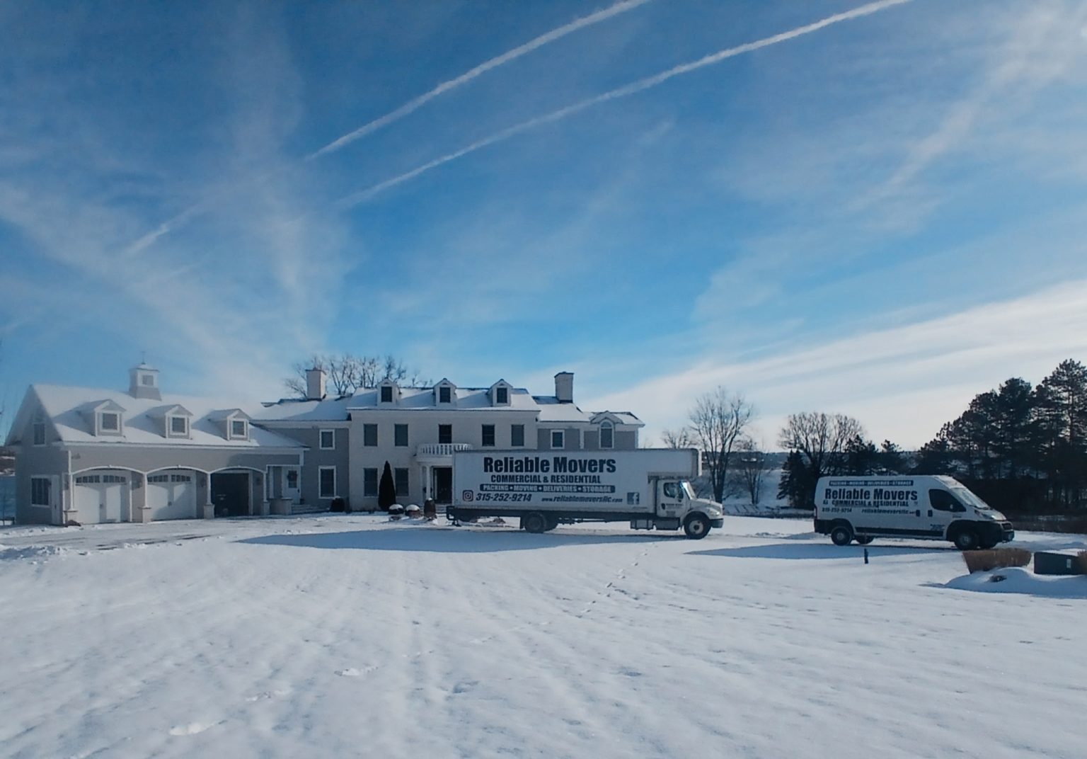 Reliable Movers interstate moving truck completing a long-distance move from Syracuse NY