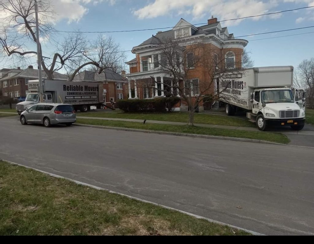 Reliable Movers two trucks on site for a large residential move