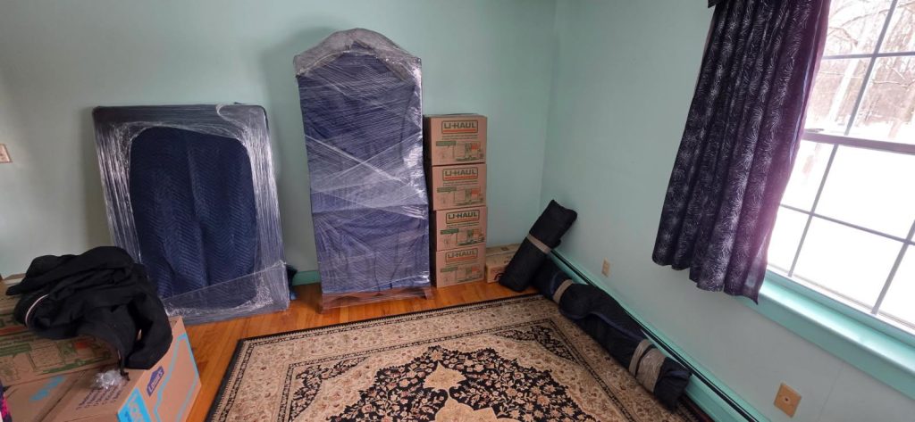 Reliable Movers packing furniture for an interstate move to Hadley, MA.