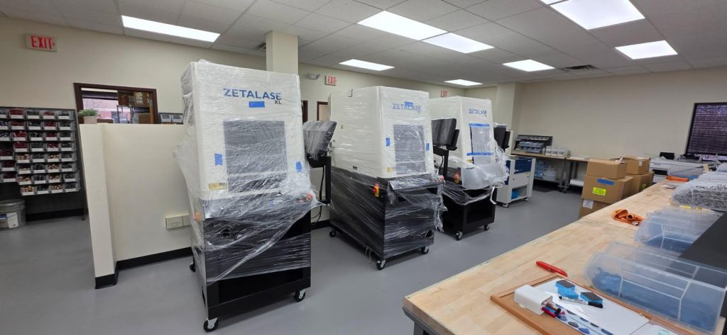 Movers setting up heavy office machines safely