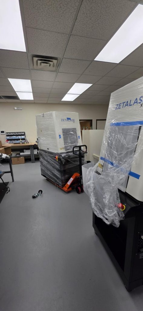 Setting up 1100 lb office equipment inside Syracuse business