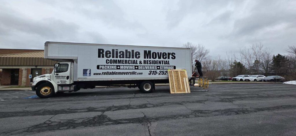 Unloading heavy machinery from 30 foot lift gate truck Syracuse office move