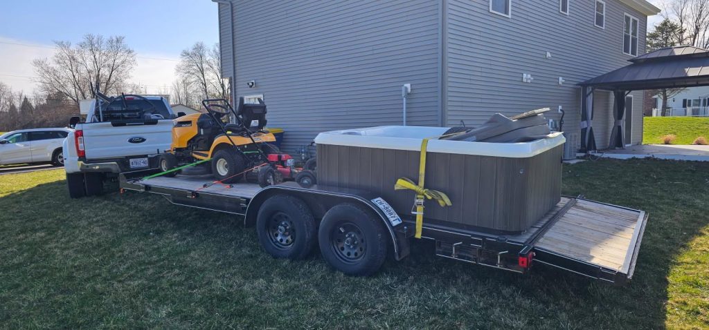 Hot tub secured on trailer for transport by professional movers in Syracuse NY