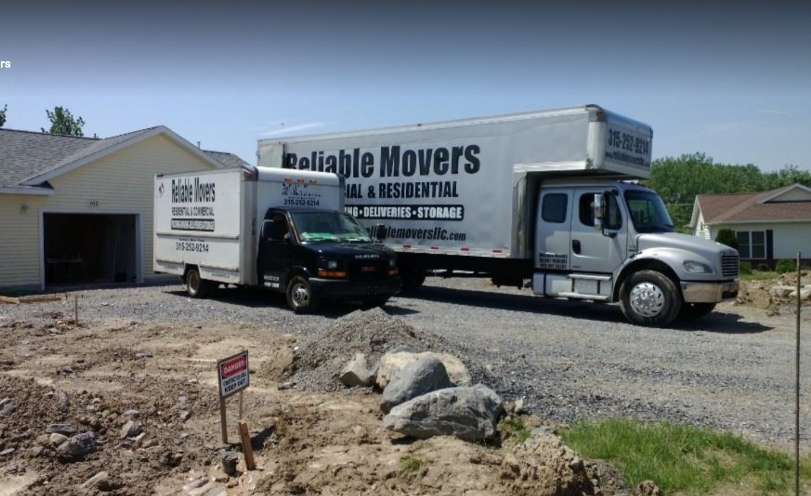 Reliable Movers 15-foot moving truck beside a 28-foot moving truck showing available truck sizes for local moving