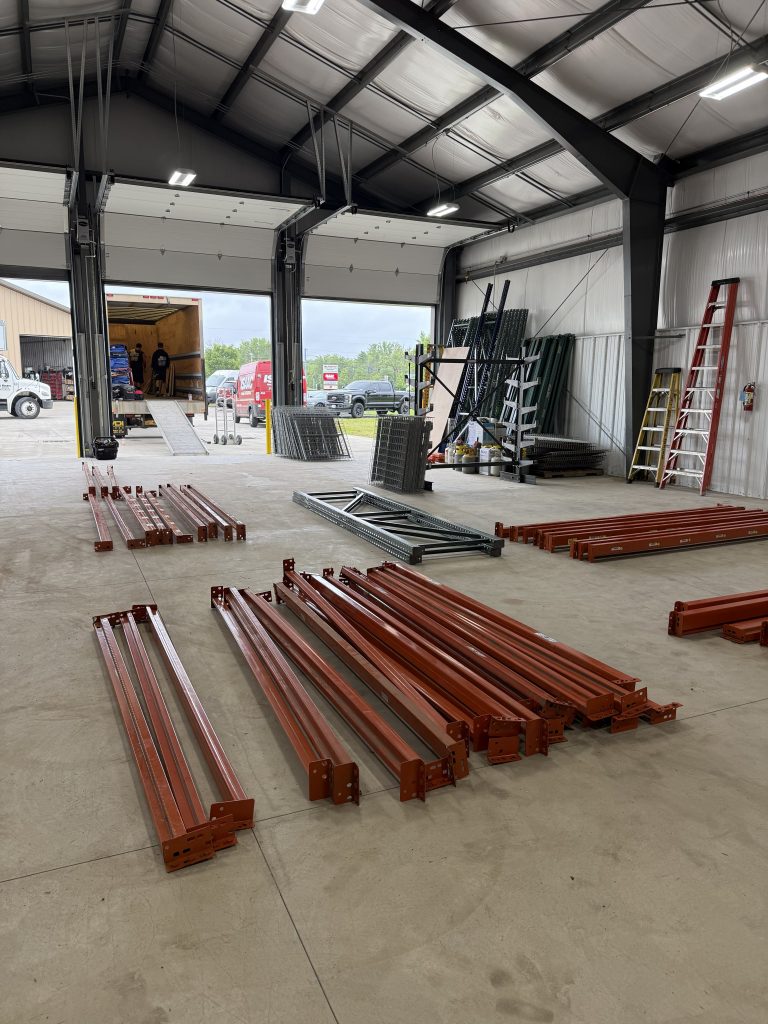 Commercial warehouse shelving and materials staged for relocation in Buffalo, NY.