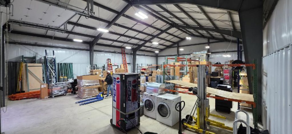 Reliable Movers relocating warehouse inventory during a commercial move in Buffalo, NY.