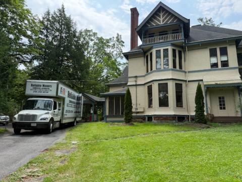Large historic Victorian home in Clinton, New York being professionally moved by Reliable Movers.