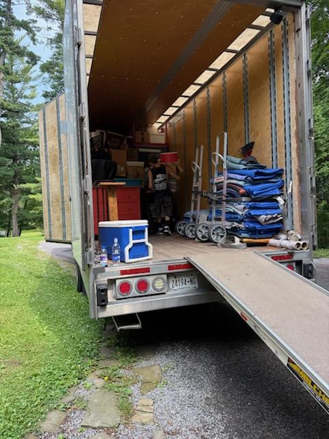 Reliable Movers loading furniture into a professionally organized moving truck during a residential move in Clinton, NY.