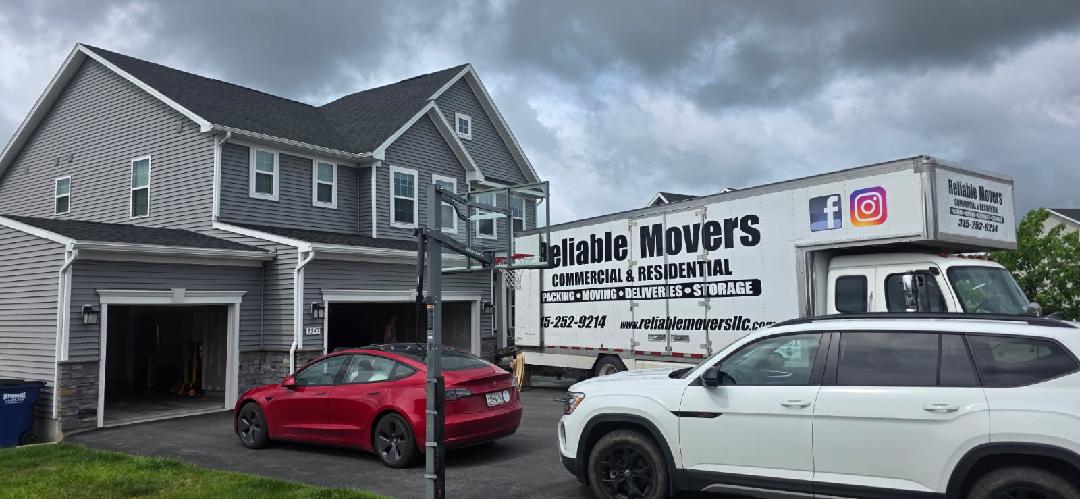 Reliable Movers loading a home in Camillus NY for an interstate move to North Carolina