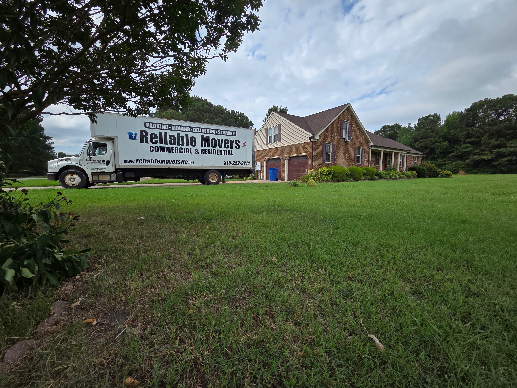 Reliable Movers loading an interstate moving truck