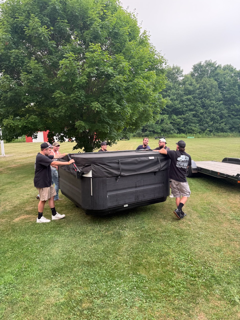 Hot tub securely strapped to trailer by Reliable Movers in Sterling NY