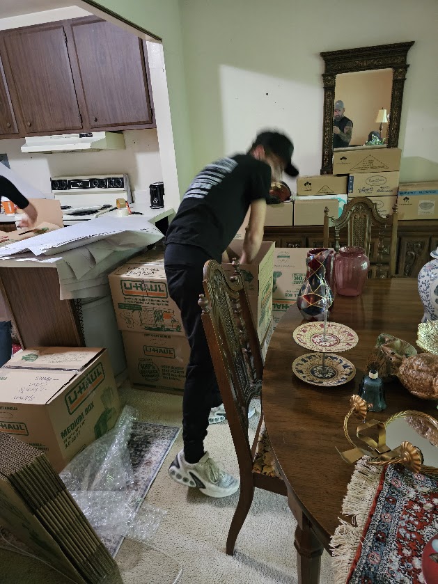 Reliable Movers packing dining room items for a long-distance move from Manlius NY