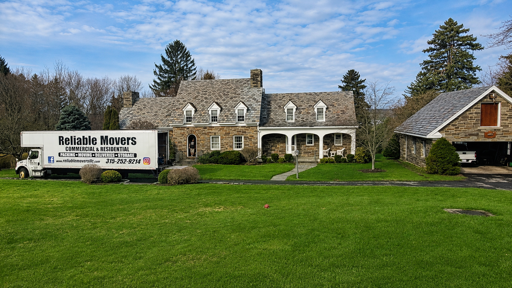Reliable Movers loading a moving truck in Skaneateles NY for an interstate move to Dennis MA
