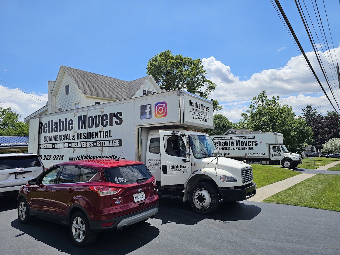 Reliable Movers completing a residential move in Auburn NY with company-owned moving trucks.
