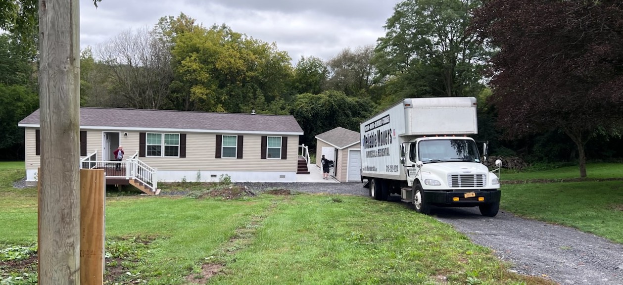 Reliable Movers completing a local move in Auburn NY with a 26-foot moving truck