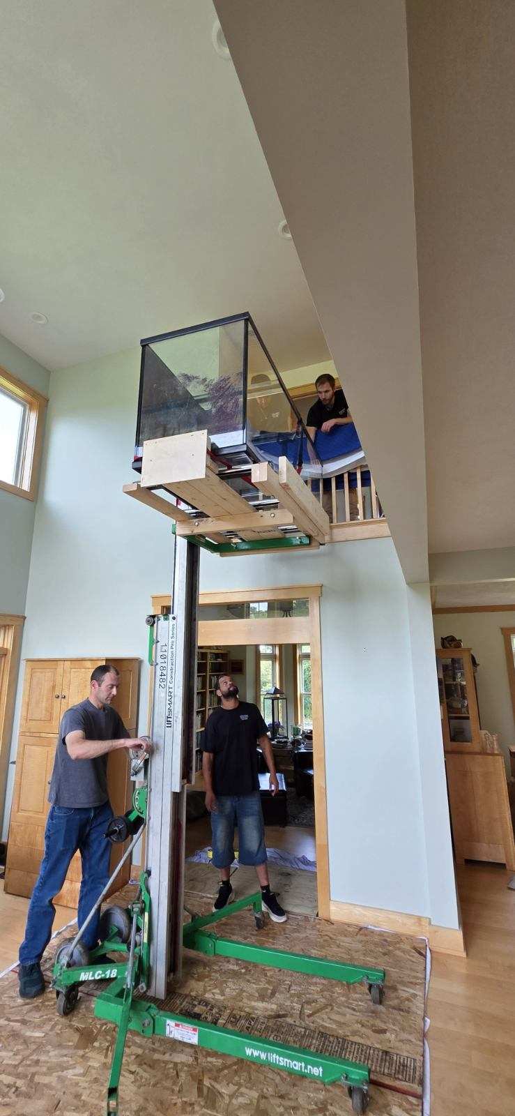 600-pound aquarium being raised to a second-floor landing in Elbridge NY
