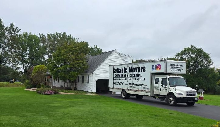 Reliable Movers loading a full 30-foot truck for an Auburn NY to Ohio interstate move