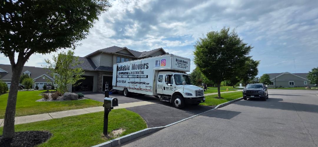 Reliable Movers truck completing a long-distance move from Baldwinsville to Rochester, NY
