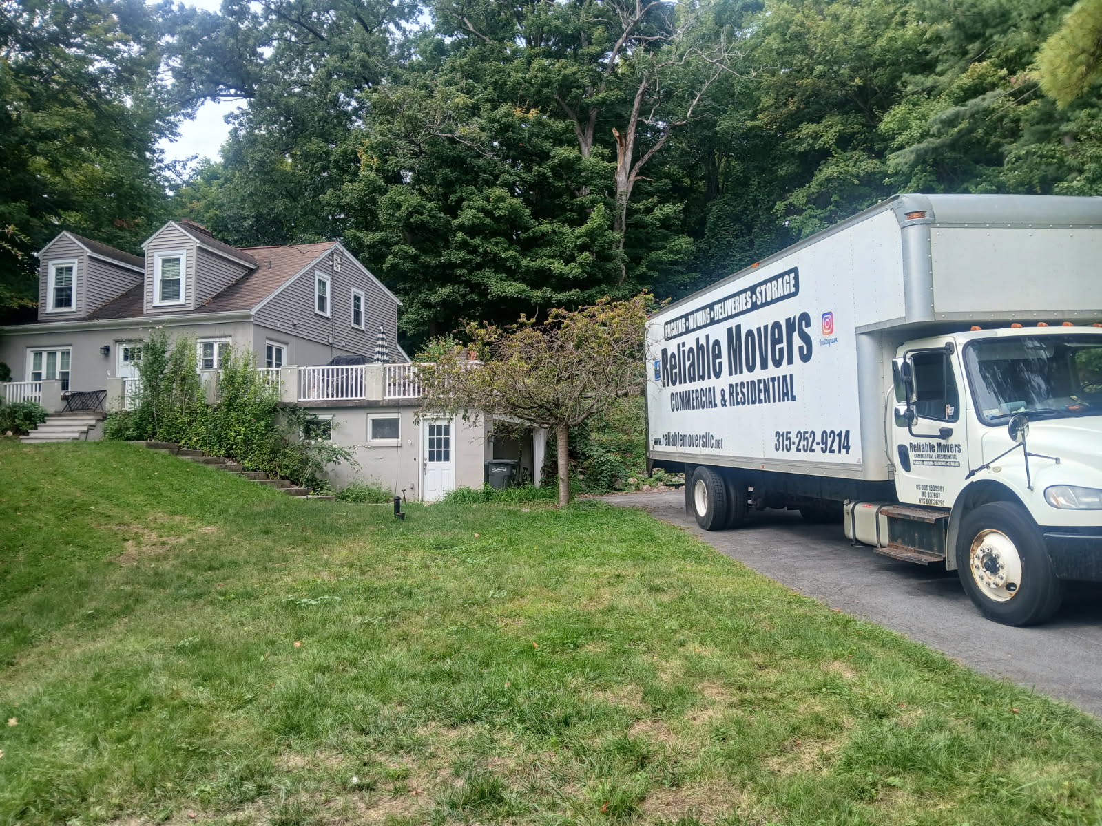 Reliable Movers truck at a home during a local move from DeWitt, NY to Solvay, NY
