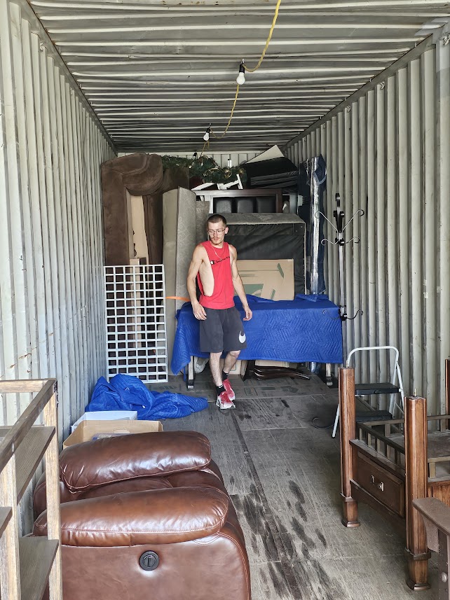 Alex of Reliable Movers working inside a moving truck