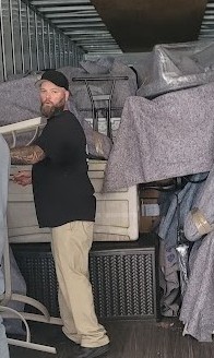 Kevin, longtime Reliable Movers crew leader working inside a moving truck