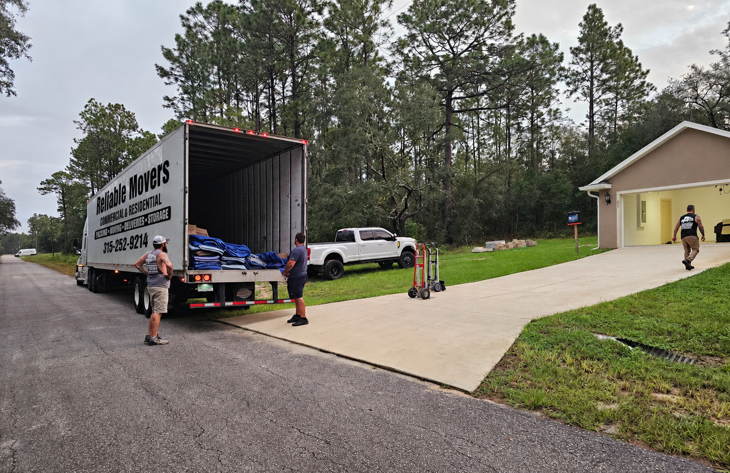 Reliable Movers tractor-trailer unloading a New York to Florida interstate shipment in Dunnellon FL